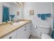 Bathroom with a white vanity, framed mirror, and a toilet at 3710 41St S Way # D, St Petersburg, FL 33711
