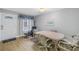 Cozy dining room with a neutral palette, featuring an oval table and seating for six at 3710 41St S Way # D, St Petersburg, FL 33711