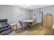 Open floor plan dining room with wood floors and a decorative painting at 3710 41St S Way # D, St Petersburg, FL 33711