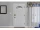 Clean white front door with stained glass window and a hanging piece of art at 3710 41St S Way # D, St Petersburg, FL 33711