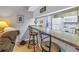 Open kitchen bar area with seating, white appliances, and a convenient kitchen layout at 3710 41St S Way # D, St Petersburg, FL 33711