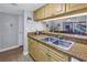 Modern kitchen with granite countertops, stainless steel sink, and open to the living area at 3710 41St S Way # D, St Petersburg, FL 33711