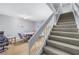 Living room with staircase leading to a dining area at 3710 41St S Way # D, St Petersburg, FL 33711