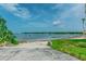 Scenic waterfront view with blue sky and calm waters, enhanced by lush greenery on either side at 3710 41St S Way # D, St Petersburg, FL 33711