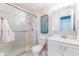 Bathroom with glass-enclosed shower and vanity at 4215 E Bay Dr # 1702F, Clearwater, FL 33764