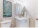 Cozy bathroom features a vanity with a cabinet, a mirrored medicine cabinet, and playful decor at 4215 E Bay Dr # 1702F, Clearwater, FL 33764