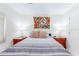 Bedroom with striped bedding, lamps, and closet at 4215 E Bay Dr # 1702F, Clearwater, FL 33764