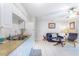 The living area is open to the kitchen with a ceiling fan at 4215 E Bay Dr # 1702F, Clearwater, FL 33764