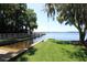 Scenic boat ramp providing waterfront access with a lush grassy area, perfect for boating enthusiasts at 4243 Tremblay Way, Palm Harbor, FL 34685