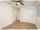 Bright bedroom features laminate floors, closet doors, and a ceiling fan, creating a cozy and inviting space at 4408 W Varn Ave, Tampa, FL 33616