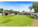 Expansive backyard features a lush lawn, pool, and outdoor shed at 4581 21St N Ave, St Petersburg, FL 33713