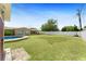 Large backyard with green lawn and a refreshing pool, perfect for relaxation and outdoor activities at 4581 21St N Ave, St Petersburg, FL 33713