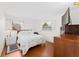 Cozy bedroom with hardwood floors, natural light, and neutral decor at 4581 21St N Ave, St Petersburg, FL 33713