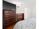 This bedroom boasts a wooden dresser with a TV on top and an adjacent closet for optimal storage at 4581 21St N Ave, St Petersburg, FL 33713