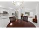 Open dining area with stylish lighting and an inviting table setting, perfect for Gathering meals and entertaining guests at 4581 21St N Ave, St Petersburg, FL 33713