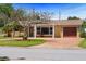 Charming single-story home featuring a cozy front porch, brick accents, and well-manicured landscaping at 4581 21St N Ave, St Petersburg, FL 33713