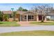 Charming single-story home featuring a cozy front porch, brick accents, and well-manicured landscaping at 4581 21St N Ave, St Petersburg, FL 33713