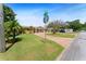 Well-maintained home with brick driveway, mature landscaping, and convenient street access on a sunny day at 4581 21St N Ave, St Petersburg, FL 33713