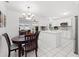 Bright kitchen with white cabinets, stainless appliances, island, and dining area at 4581 21St N Ave, St Petersburg, FL 33713