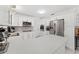 Beautiful white kitchen features stainless appliances, quartz countertops, and tile backsplash at 4581 21St N Ave, St Petersburg, FL 33713