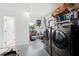 This large laundry room features modern washer and dryer units, ample storage, and a utility sink at 4581 21St N Ave, St Petersburg, FL 33713