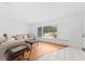 Bright living room featuring hardwood floors, comfortable sofa, and large windows offering ample natural light at 4581 21St N Ave, St Petersburg, FL 33713