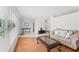 Inviting living room with hardwood floors, neutral paint, and lots of natural light, creating a warm and welcoming atmosphere at 4581 21St N Ave, St Petersburg, FL 33713