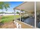 Covered patio with a glimpse of the lush backyard and pool at 4581 21St N Ave, St Petersburg, FL 33713