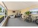 Enclosed patio with grill, table, chairs, and bikes offers an outdoor living space at 4581 21St N Ave, St Petersburg, FL 33713