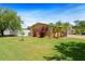 Spacious backyard featuring lush green grass, mature trees, and a white fence at 4581 21St N Ave, St Petersburg, FL 33713