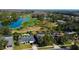 Aerial view of the community showcasing the homes, golf course, and lake at 4617 Cloverlawn Dr, Tampa, FL 33624