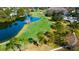 Panoramic aerial view of the golf course and lake in the community at 4617 Cloverlawn Dr, Tampa, FL 33624