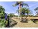 Well-maintained backyard with mature landscaping and manicured lawn at 4617 Cloverlawn Dr, Tampa, FL 33624