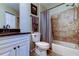 Neutral bathroom with vanity, toilet, and shower/tub combo with tile surround at 4617 Cloverlawn Dr, Tampa, FL 33624