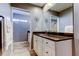 Bathroom with a vanity featuring granite countertops and a mirror that reflects the shower at 4617 Cloverlawn Dr, Tampa, FL 33624