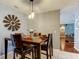 Dining room featuring dark wood table, pendant lights, and view to the living room at 4617 Cloverlawn Dr, Tampa, FL 33624