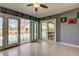 Light-filled Florida room provides a view to a screened in pool with patio at 4617 Cloverlawn Dr, Tampa, FL 33624