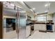 Updated kitchen with stainless appliances, recessed lighting, tile floor and white cabinetry at 4617 Cloverlawn Dr, Tampa, FL 33624