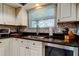The kitchen has granite countertops, a stainless steel sink, and updated appliances at 4617 Cloverlawn Dr, Tampa, FL 33624