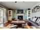 Cozy living room features a fireplace, hardwood floors, and plenty of natural light at 4617 Cloverlawn Dr, Tampa, FL 33624