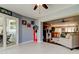 Open floorplan shows light-filled living room with tile floor and view to the game room at 4617 Cloverlawn Dr, Tampa, FL 33624