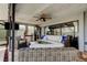The enclosed patio features stylish lounge furniture, a ceiling fan, and a TV at 4617 Cloverlawn Dr, Tampa, FL 33624