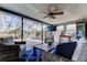 Enclosed patio features a ceiling fan, lounge furniture and exterior view at 4617 Cloverlawn Dr, Tampa, FL 33624