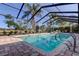 An inviting in-ground pool is fully screened, creating a relaxing atmosphere at 4617 Cloverlawn Dr, Tampa, FL 33624