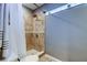 Shower stall featuring ceramic tiles, glass block windows, and a shower curtain at 4617 Cloverlawn Dr, Tampa, FL 33624