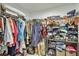 Walk-in closet features ample space with shelving and hanging racks for clothing at 470 Sunset N Rd, Rotonda West, FL 33947
