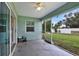 Screened lanai/patio with views of the backyard and adjacent neighborhood at 470 Sunset N Rd, Rotonda West, FL 33947