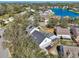 Aerial view of a residential neighborhood featuring a lake and pool at 4710 69Th E Ct, Palmetto, FL 34221