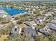 Aerial view of a residential neighborhood featuring a lake and various home styles at 4710 69Th E Ct, Palmetto, FL 34221