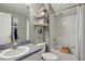Well-lit bathroom with a sink, toilet, and a shower/tub combination, complemented by stylish decor at 4710 69Th E Ct, Palmetto, FL 34221